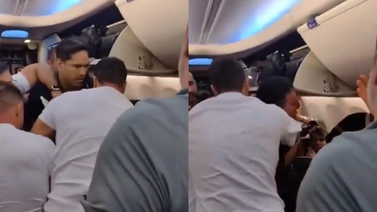 Watch: Passenger attempts to open plane’s emergency door mid-air